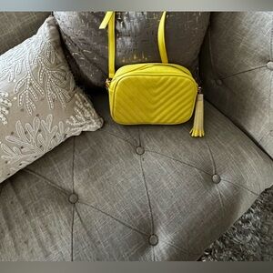 Unbranded new yellow bag, inside has a little pocket